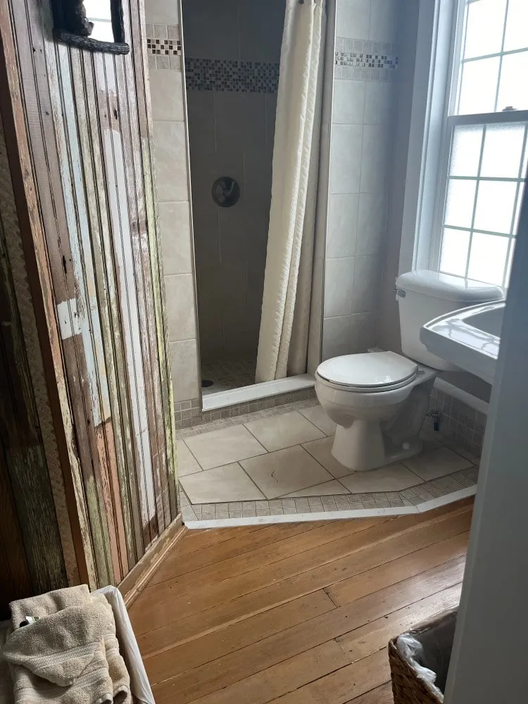 A newly remodelled bathroom with a tiled walk-in shower